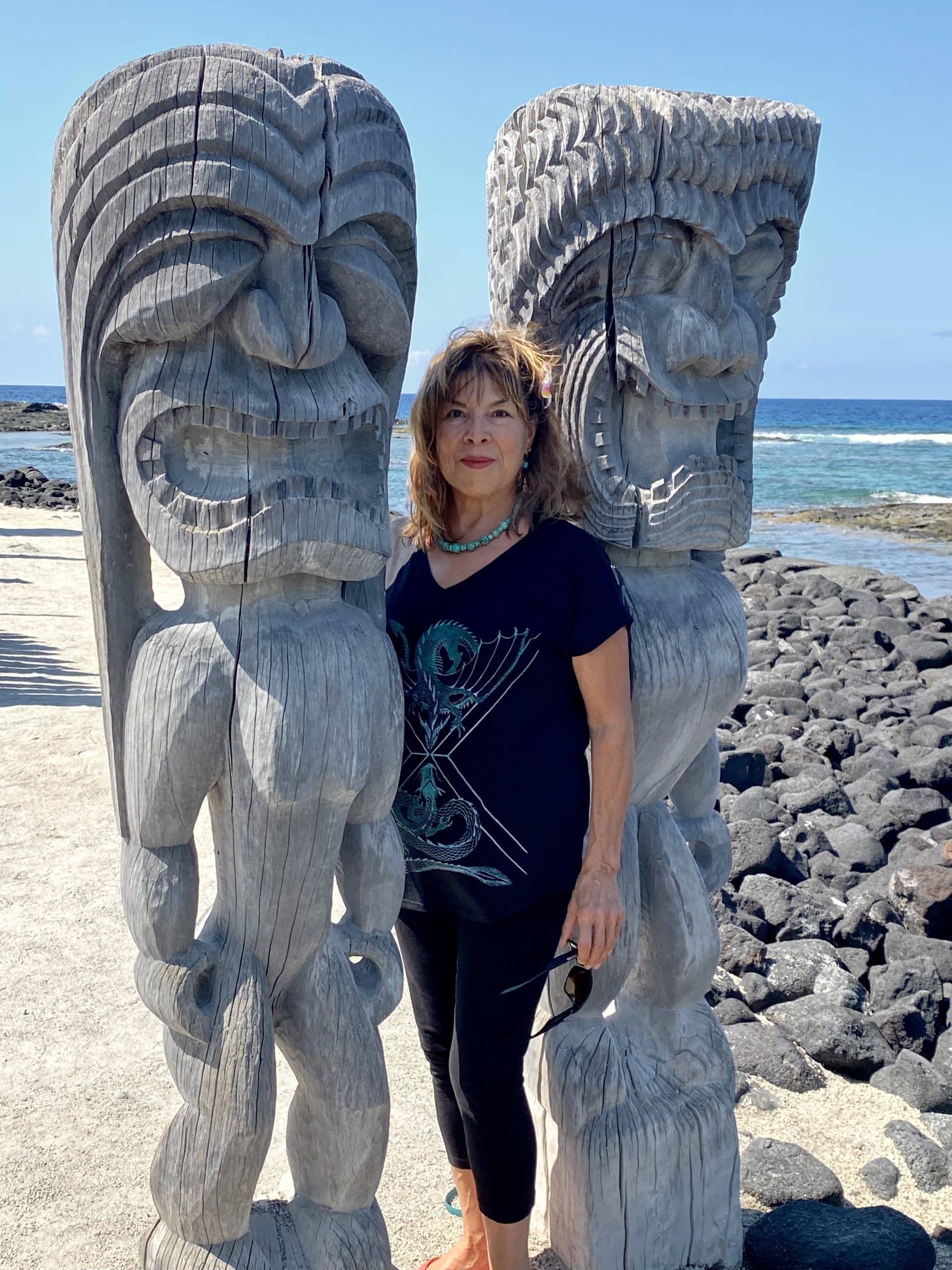 Woman with Two Tiki Statues